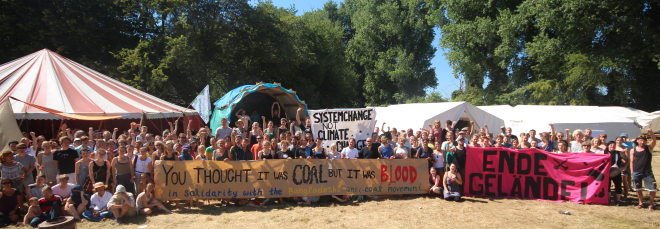 A thousand of people at lunch of Rhineland Klima Camp in resistance from Germany, around Europe and beyond stood in Solidarity with Phulbari protesters on the tenth anniversary of Phulbari outburst on 26 August 2016. Photo credit: Klima Camp Solidarity